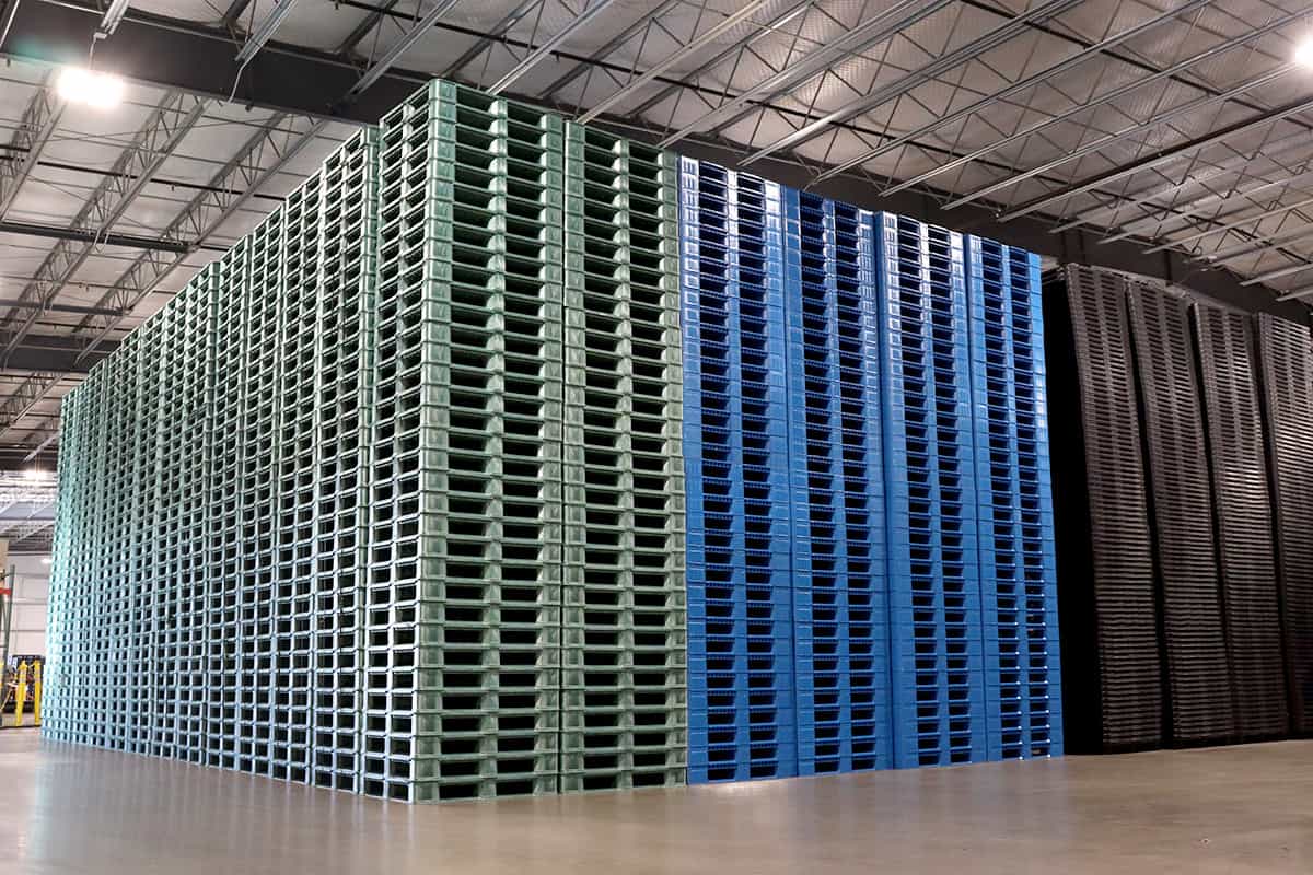 warehouse plastic pallets stacked
